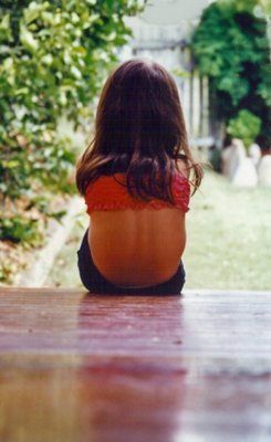 girl sitting on porch