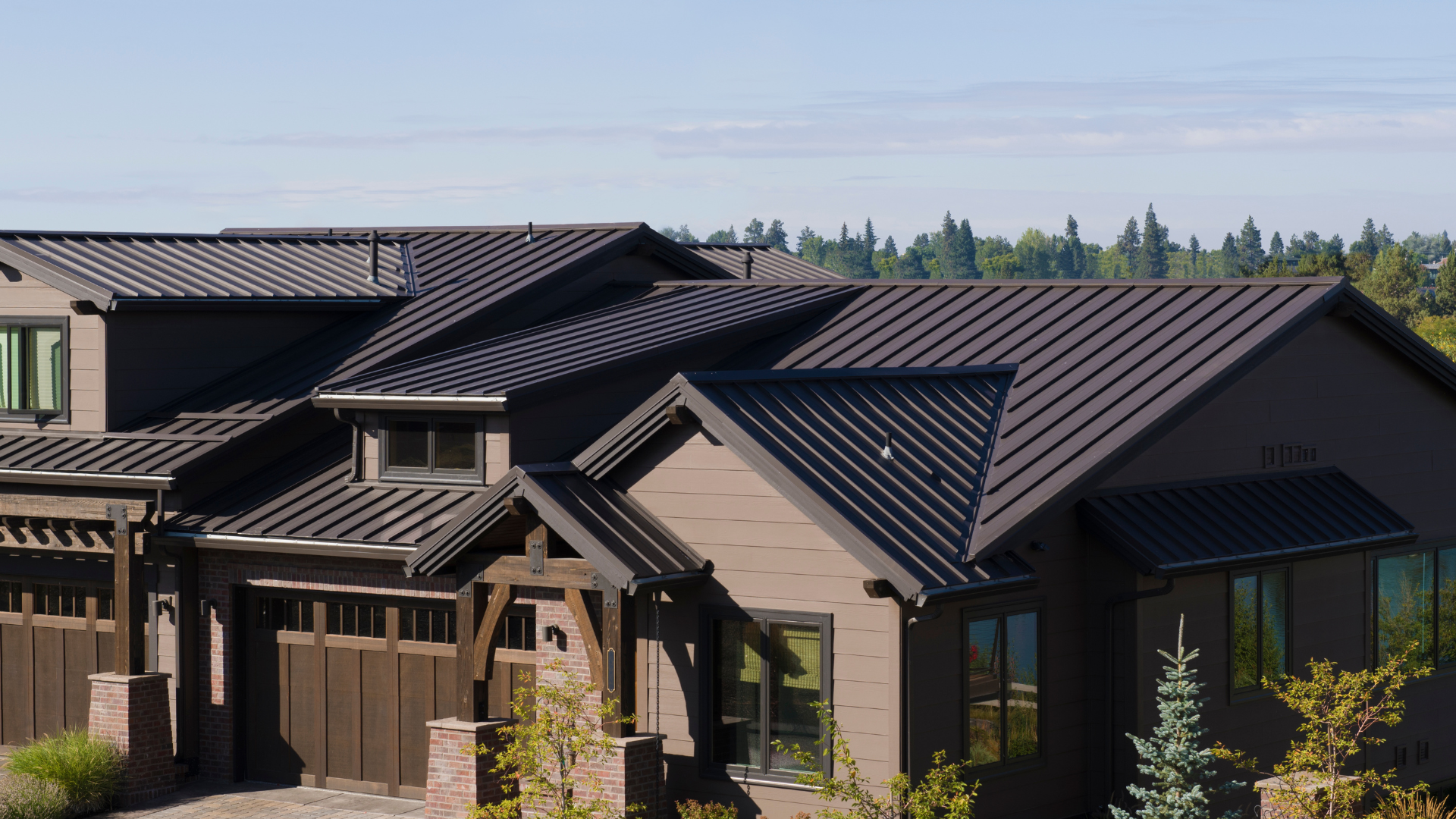 A large house with a brown roof and a garage