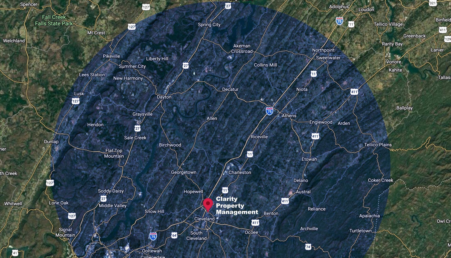 Aerial view of a city center with a blue circle overlay, possibly indicating a geographic area of interest.