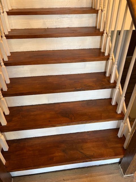 Stairs after being refinished with golden stain