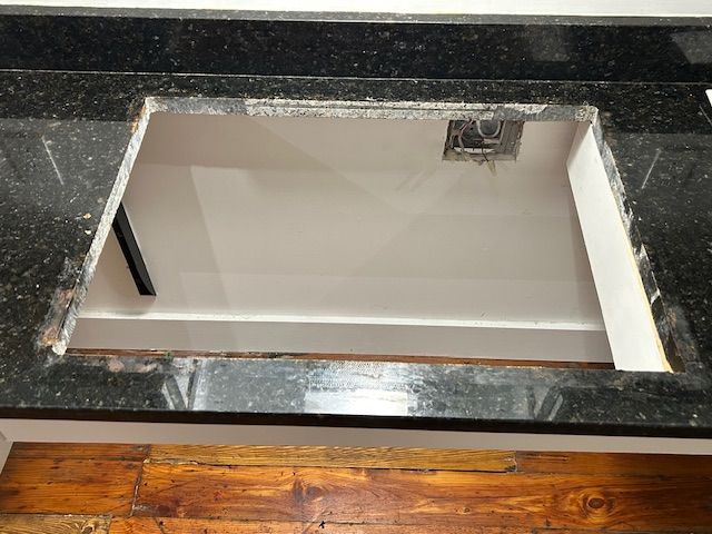Pull out of old stove top from counter