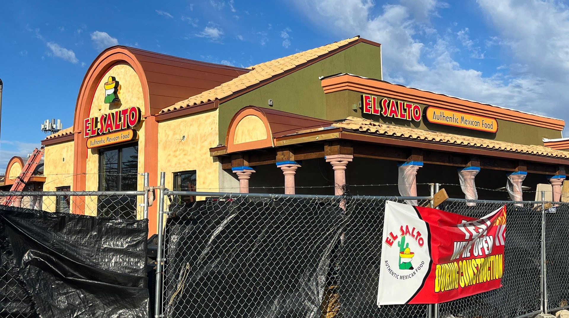 El Mazatlan restaurant under construction, surrounded by a construction fence.