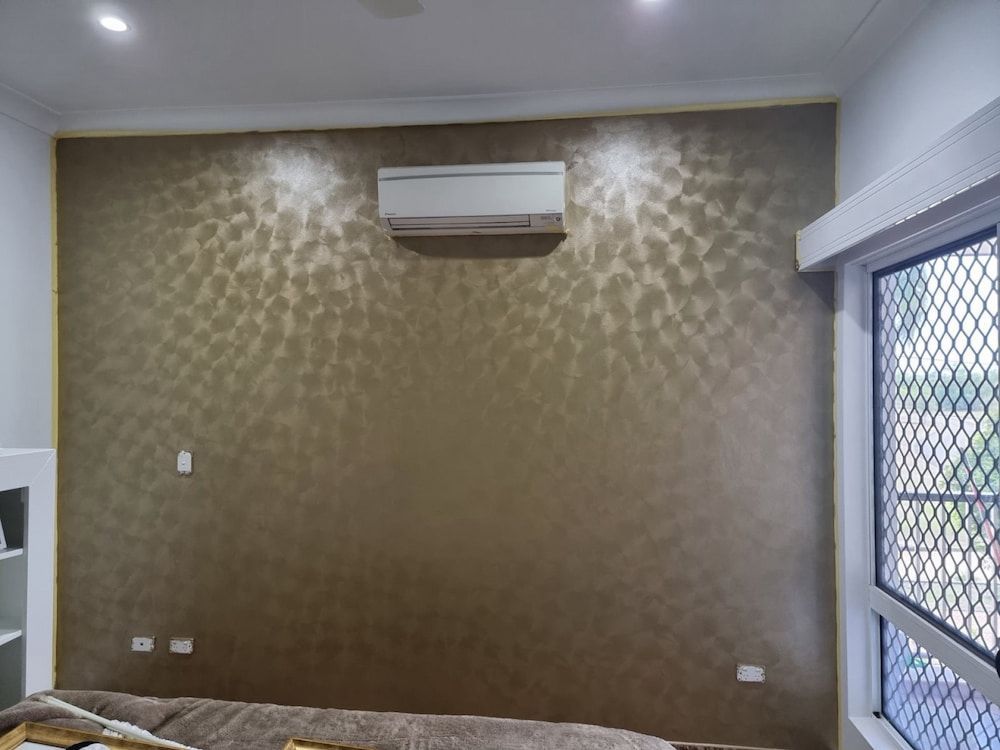 Brown Patterned Accent Wall With Ac Unit, Recessed Lighting, and a Window — Prestige Painting NT in Zuccoli, NT