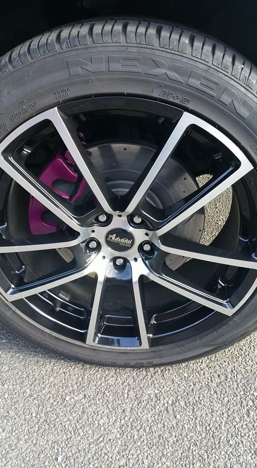 A Close Up of a Car Wheel With a Purple Brake Caliper — Wodonga Brake & Clutch In Wodonga, VIC
