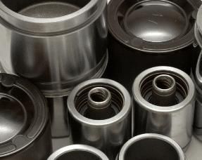 A Bunch of Metal Cylinders Are Sitting on Top of Each Other on a Table — Wodonga Brake & Clutch In Wodonga, VIC