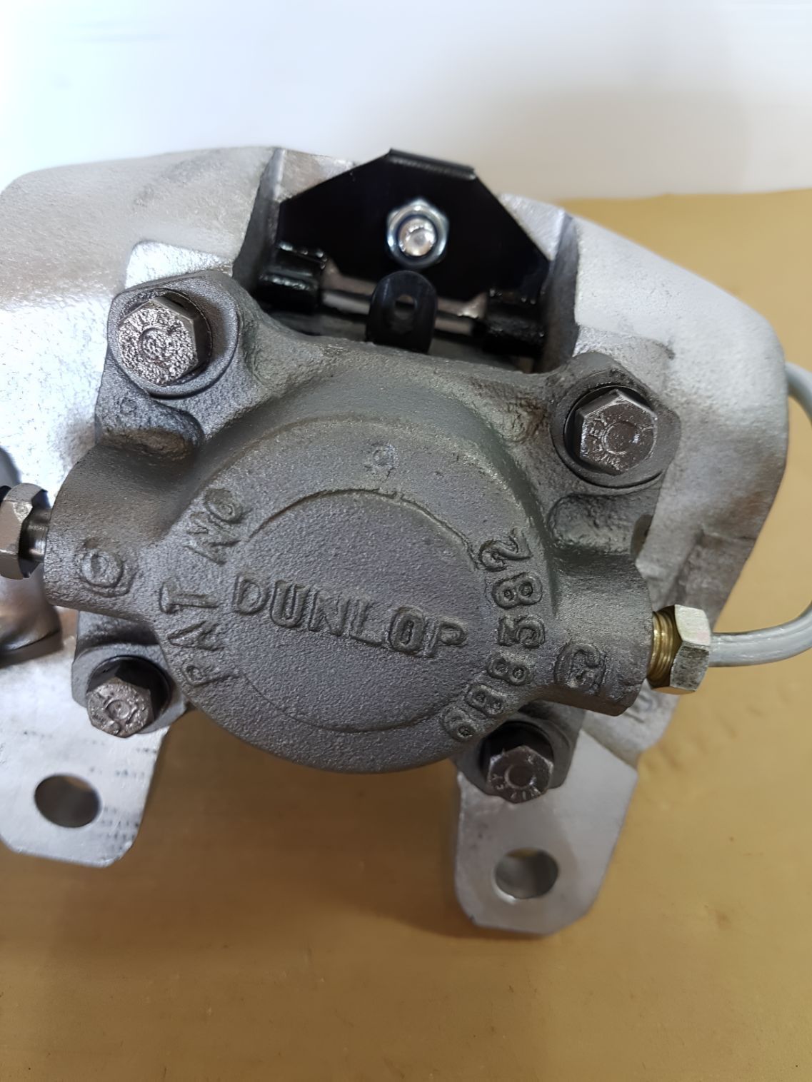 A Close Up Of A Dunlop Brake Caliper On A Table — Wodonga Brake & Clutch In Wodonga, VIC