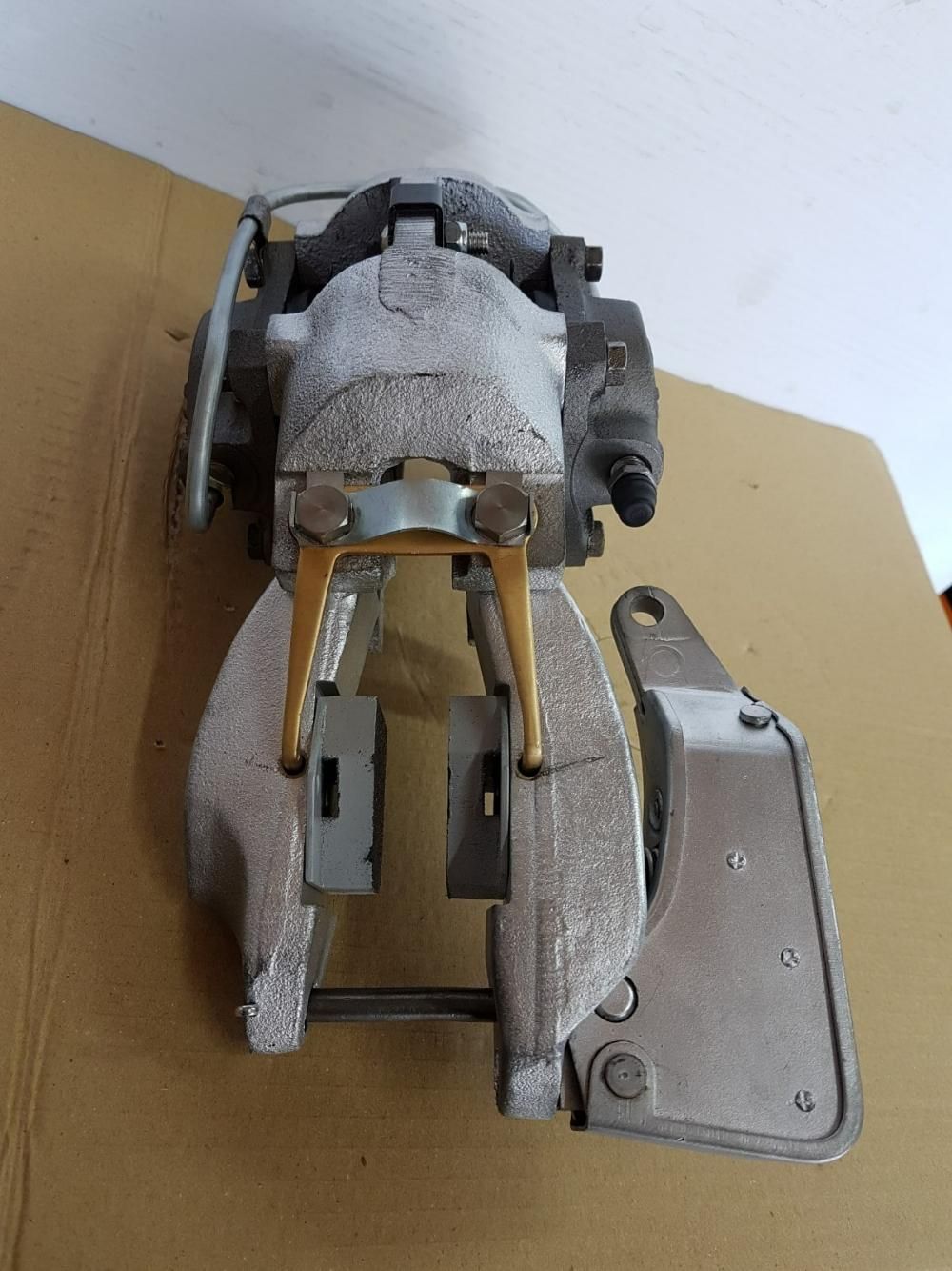 A Metal Object is Sitting on Top of a Cardboard Box — Wodonga Brake & Clutch In Wodonga, VIC