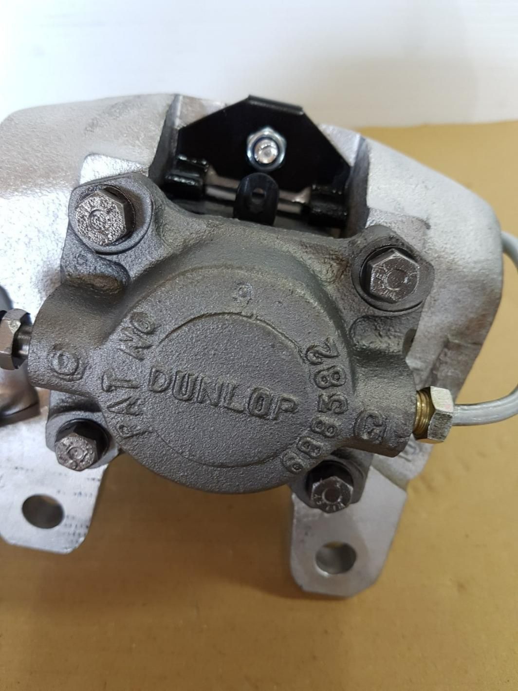 A Close Up of a Brake Caliper on a Table — Wodonga Brake & Clutch In Wodonga, VIC