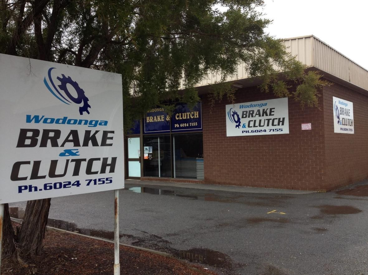 A Sign for Wodonga Brake and Clutch is in Front of a Brick Building — Wodonga Brake & Clutch In Wodonga, VIC