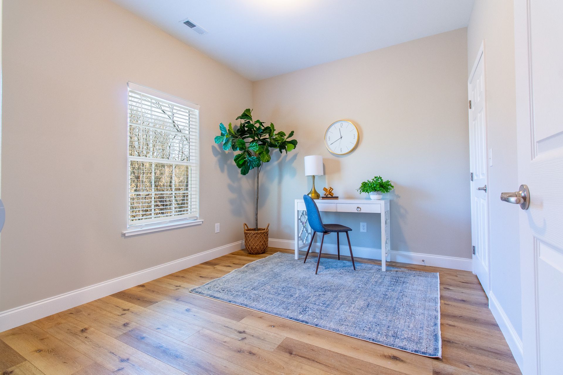 There is a desk and chair in the room.