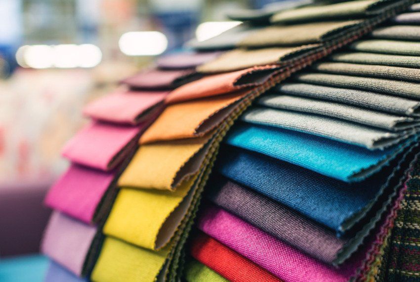 Colourful upholstery fabric samples in a furniture store.