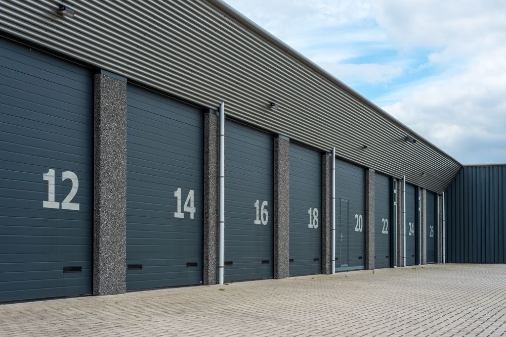 Row Of Gray Industrial Storage Doors In Warehouse