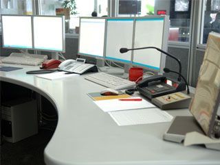 Office desk with multiple computer monitors