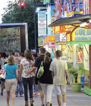Photo of a midway with food vendors.