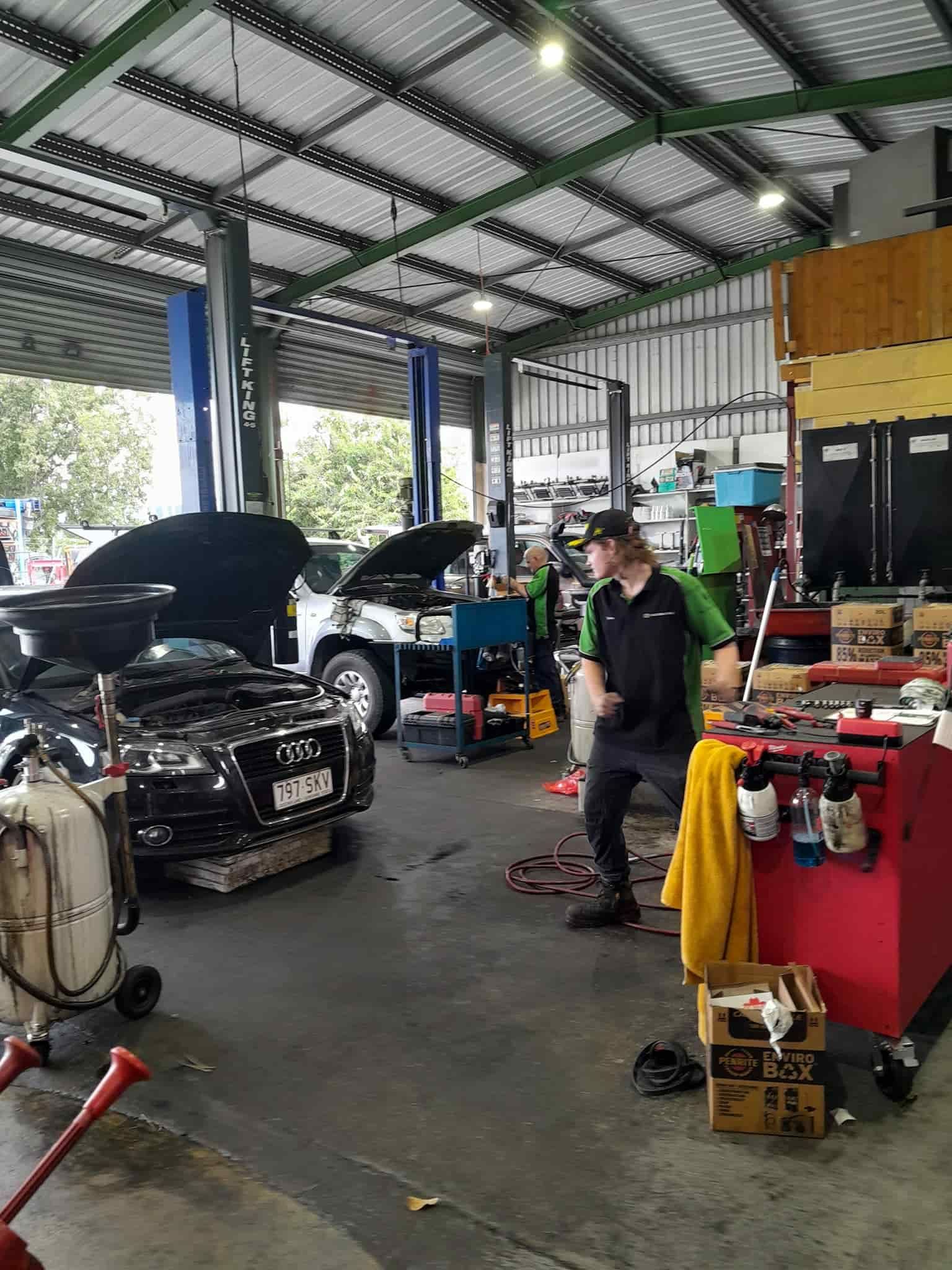A Man is Working on a Car in a Garage — CB Automotive In Yatala, QLD