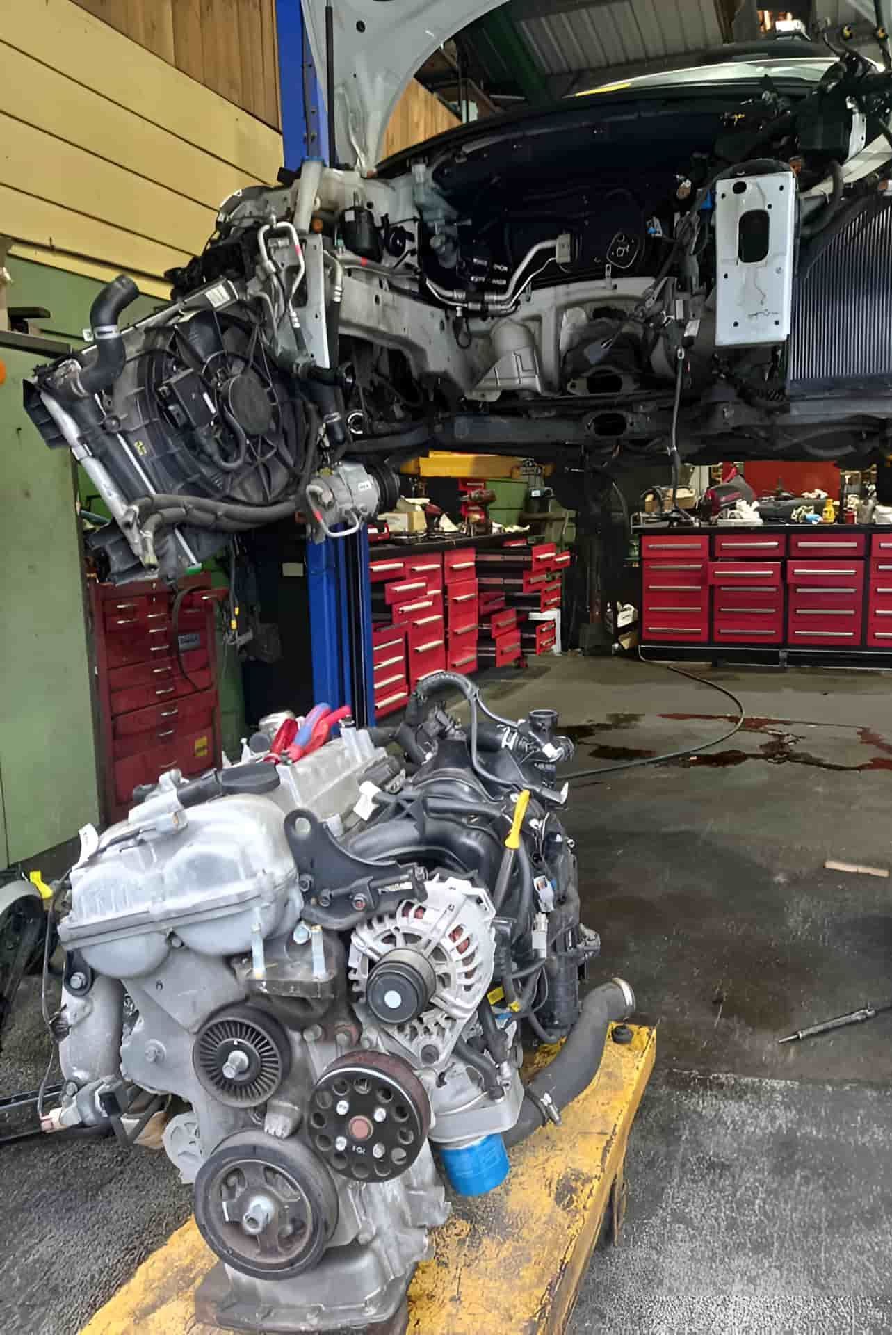 A Car Engine is Sitting on Top of a Yellow Pallet in a Garage — CB Automotive In Yatala, QLD