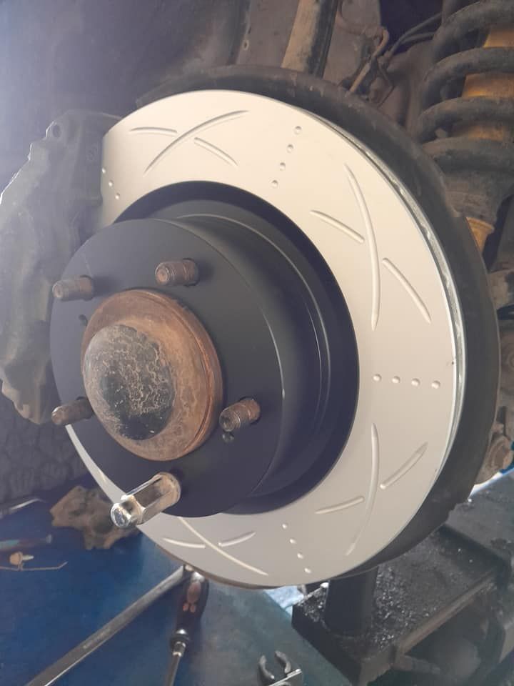 A close up of a brake disc on a car — CB Automotive In Yatala, QLD