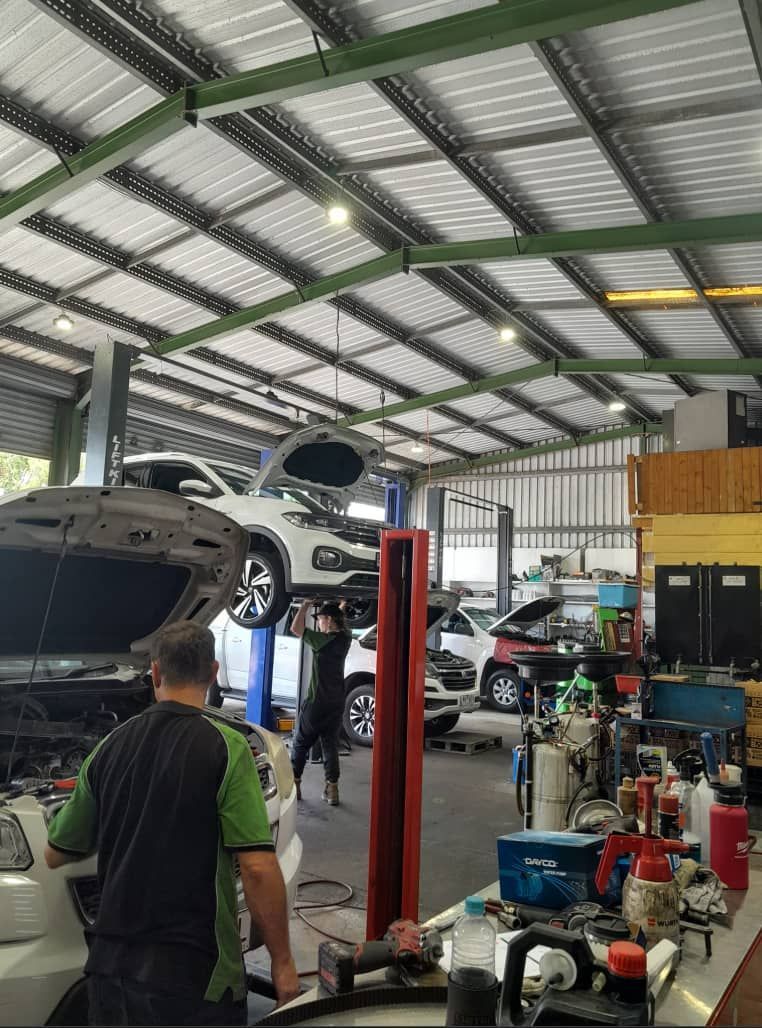 A Man is Working on a Garage — CB Automotive In Yatala, QLD