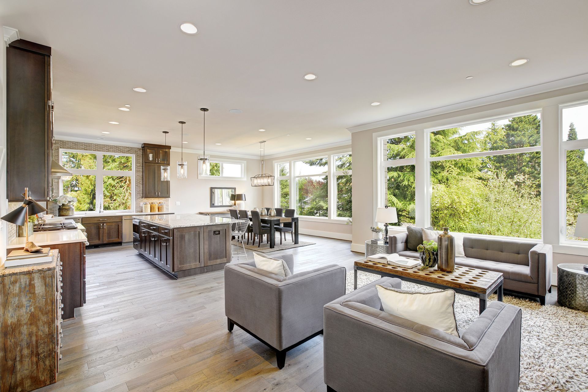 A living room filled with furniture and a lot of windows.