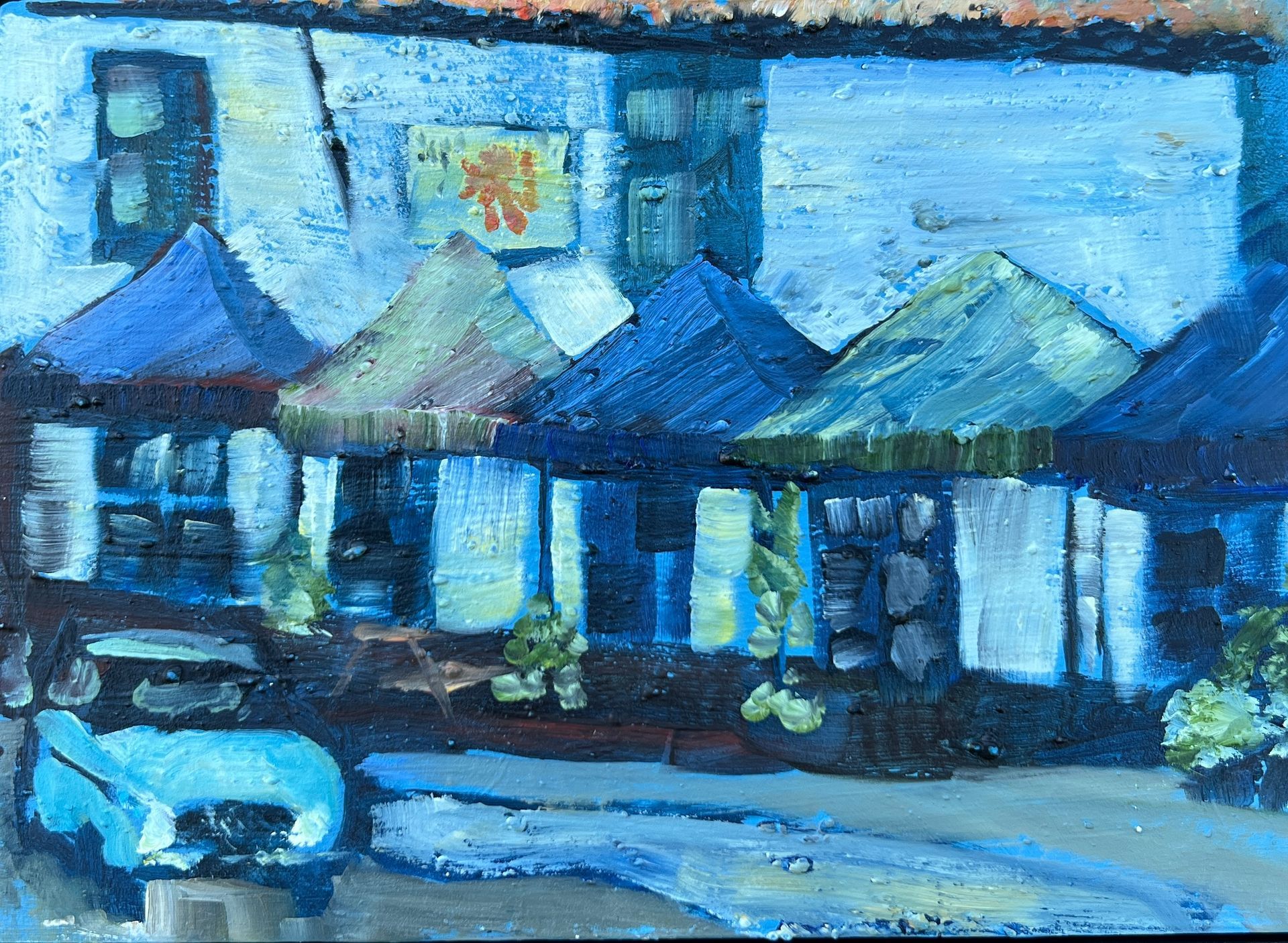 An oil painting of a rainy day in Swaffham with the hint of a warm welcome in the Red Lion pub.