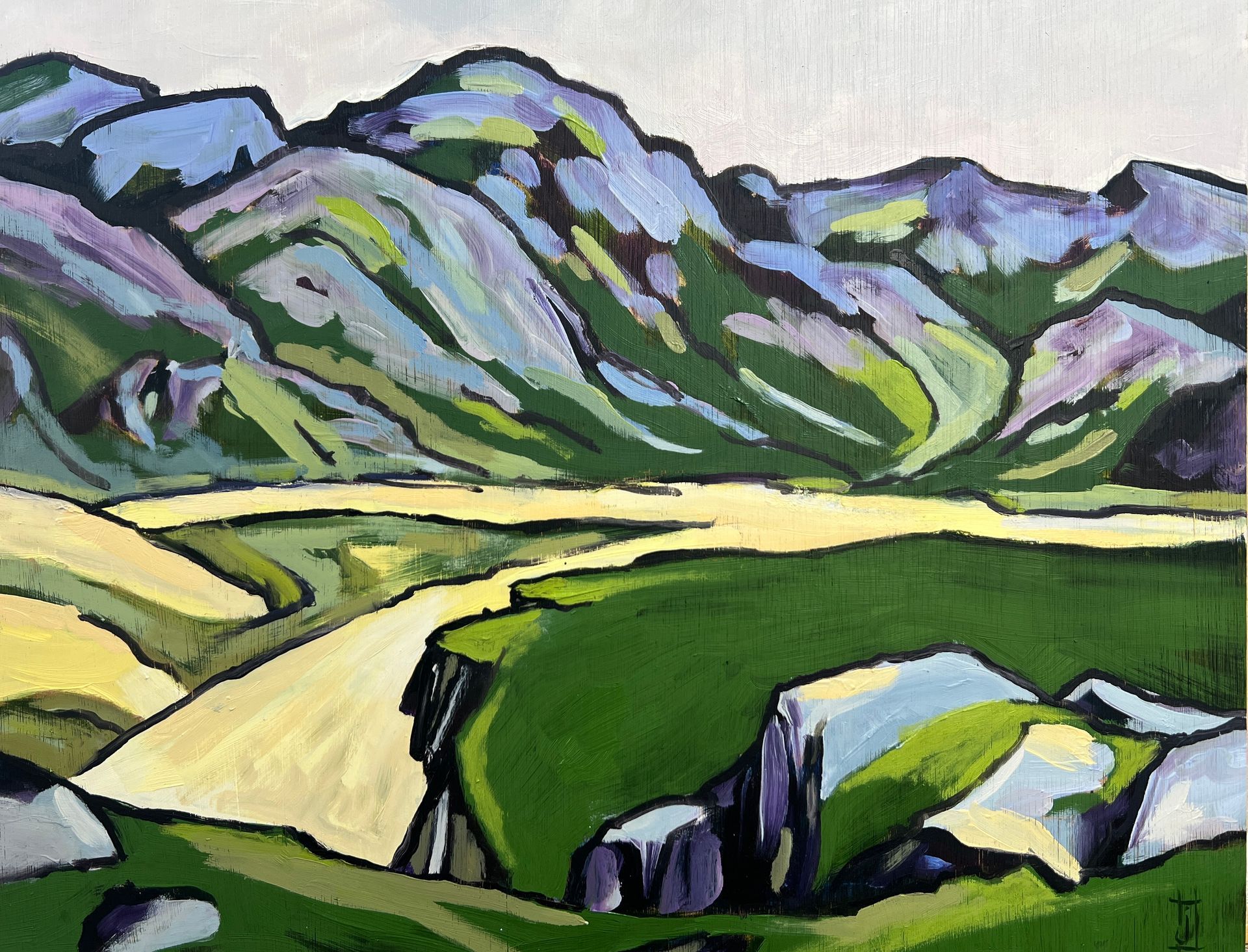 Blue and violet hills with green swathes in foreground