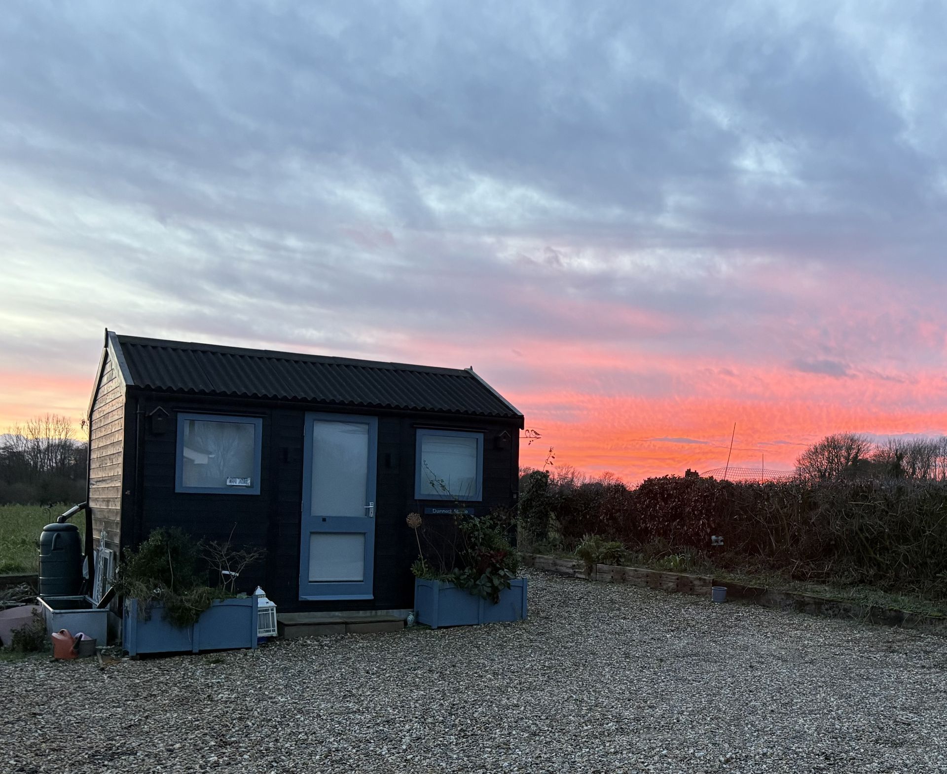 Sunset behind Dunnock Studio.
