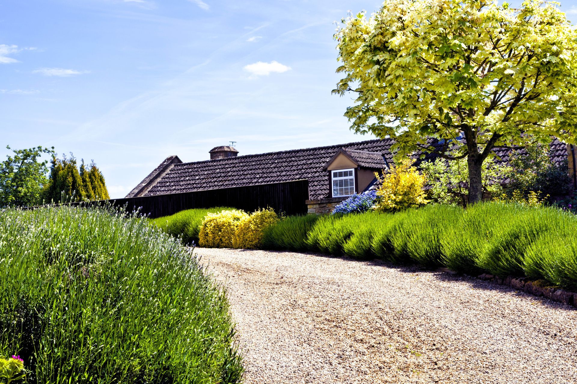 Home with a well-maintained gravel driveway