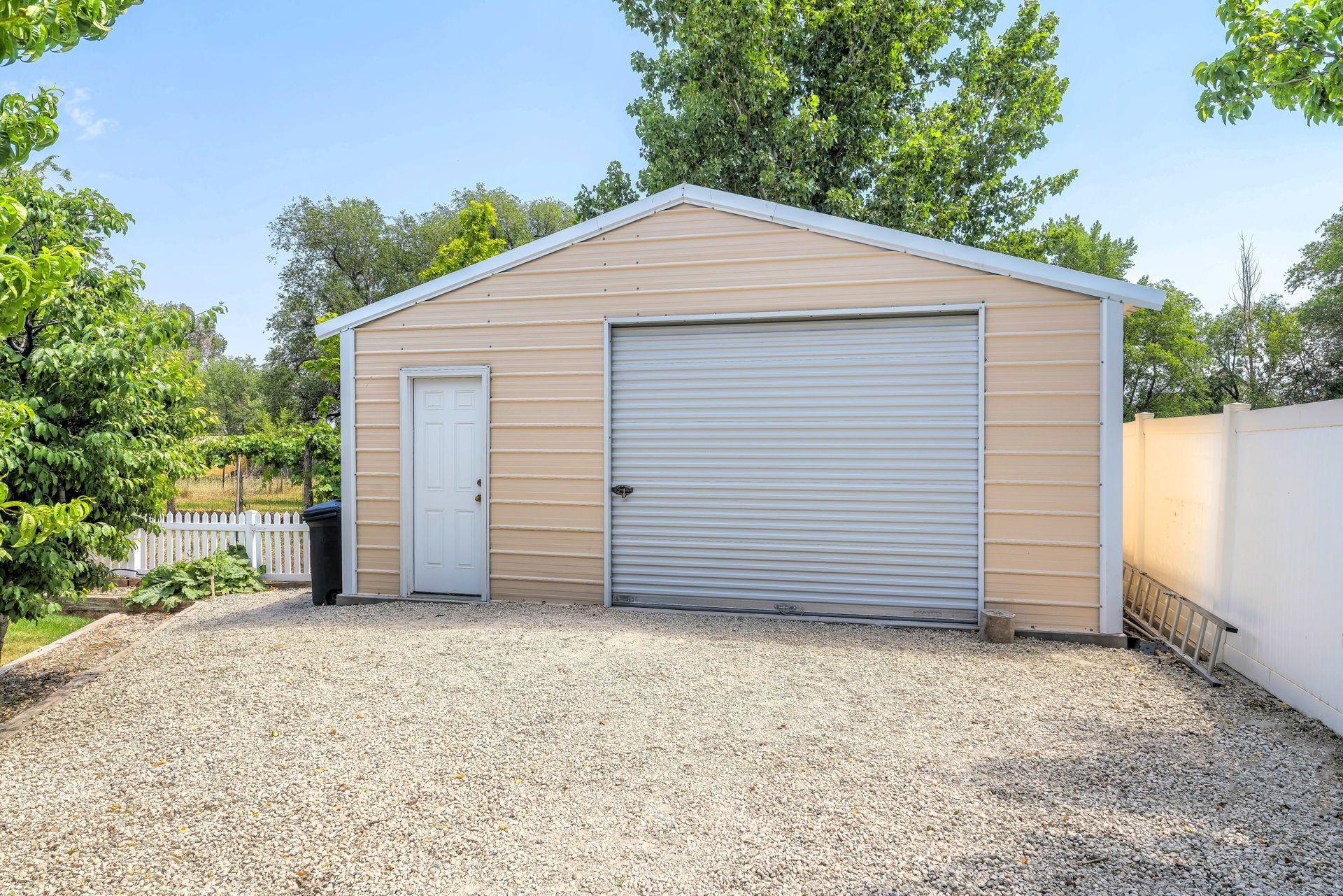 Gravel driveway to detached gable garage in Marion, IL