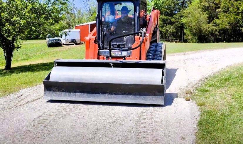 expert gravel driveway repair with vehicle on homeowner’s driveway