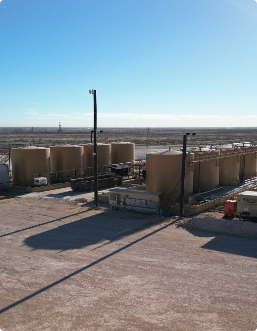 An aerial view of a large industrial area with lots of tanks.