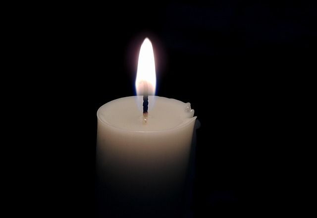 Glowing candle symbolizing comfort from funeral homes in Gilbert, AZ.