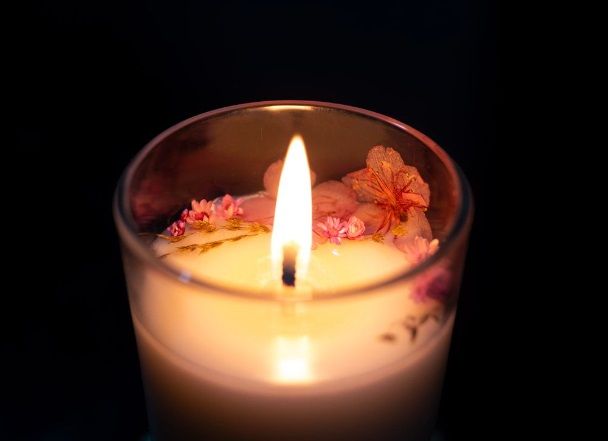 Memorial candle with floral accents for funeral homes in Chandler, AZ.