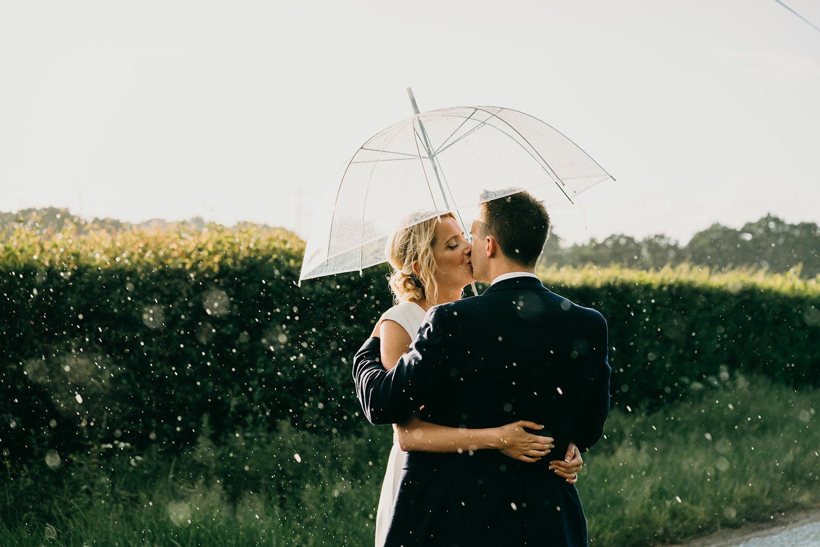 Reigate wedding bride and groom under umbrella