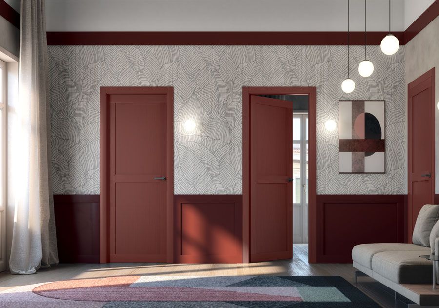 Interno con porte, finiture e decorazioni murali rosse. 