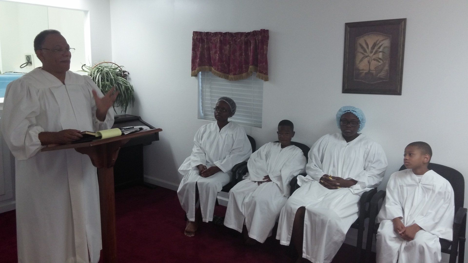 A Pastor And A Four Members Wearing White Dress | Waverly, GA | Calvary Christian Center