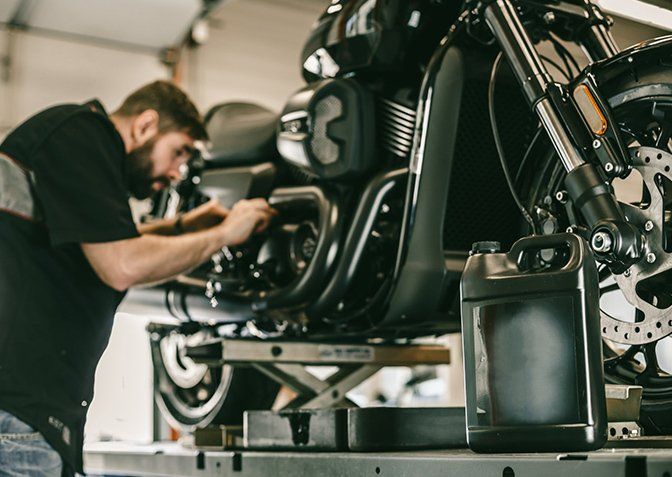 Mechanic Repairing Motorcycle — Terry Austin’s Crash Repairs in Toowoomba, QLD