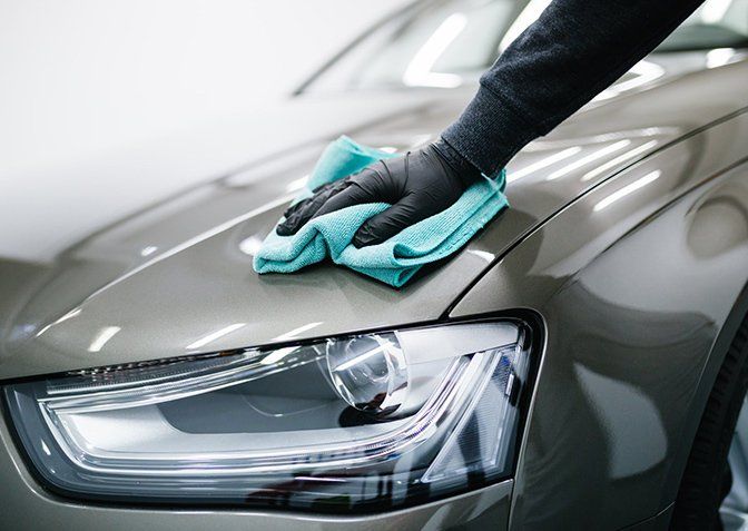 Man Cleaning Car with Microfiber Cloth — Terry Austin’s Crash Repairs in Toowoomba, QLD