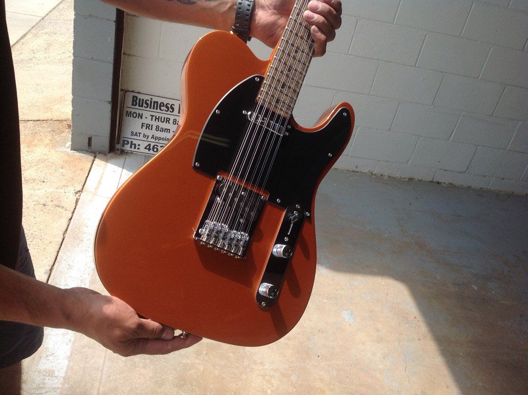 Brown Guitar — Terry Austin’s Crash Repairs in Toowoomba, QLD