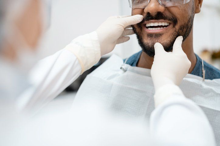 man receiving teeth whitening
