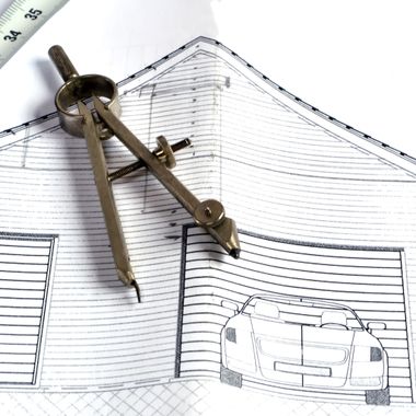 Schematics on a plan for a garage door construction