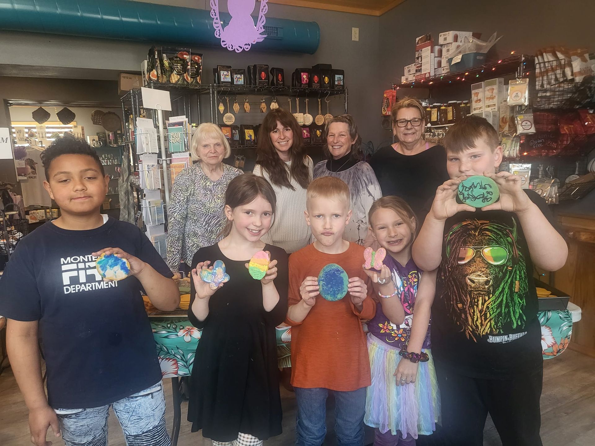 A group of children are posing for a picture in a store.