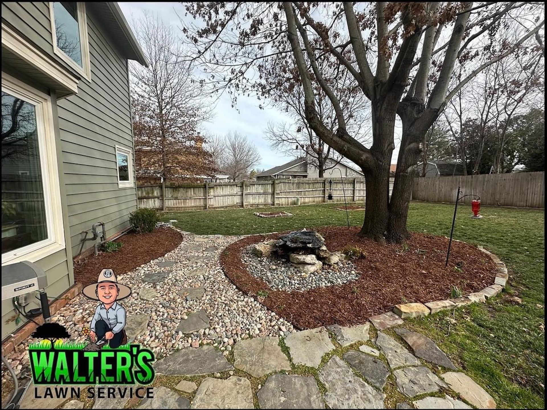 A backyard with a stone walkway