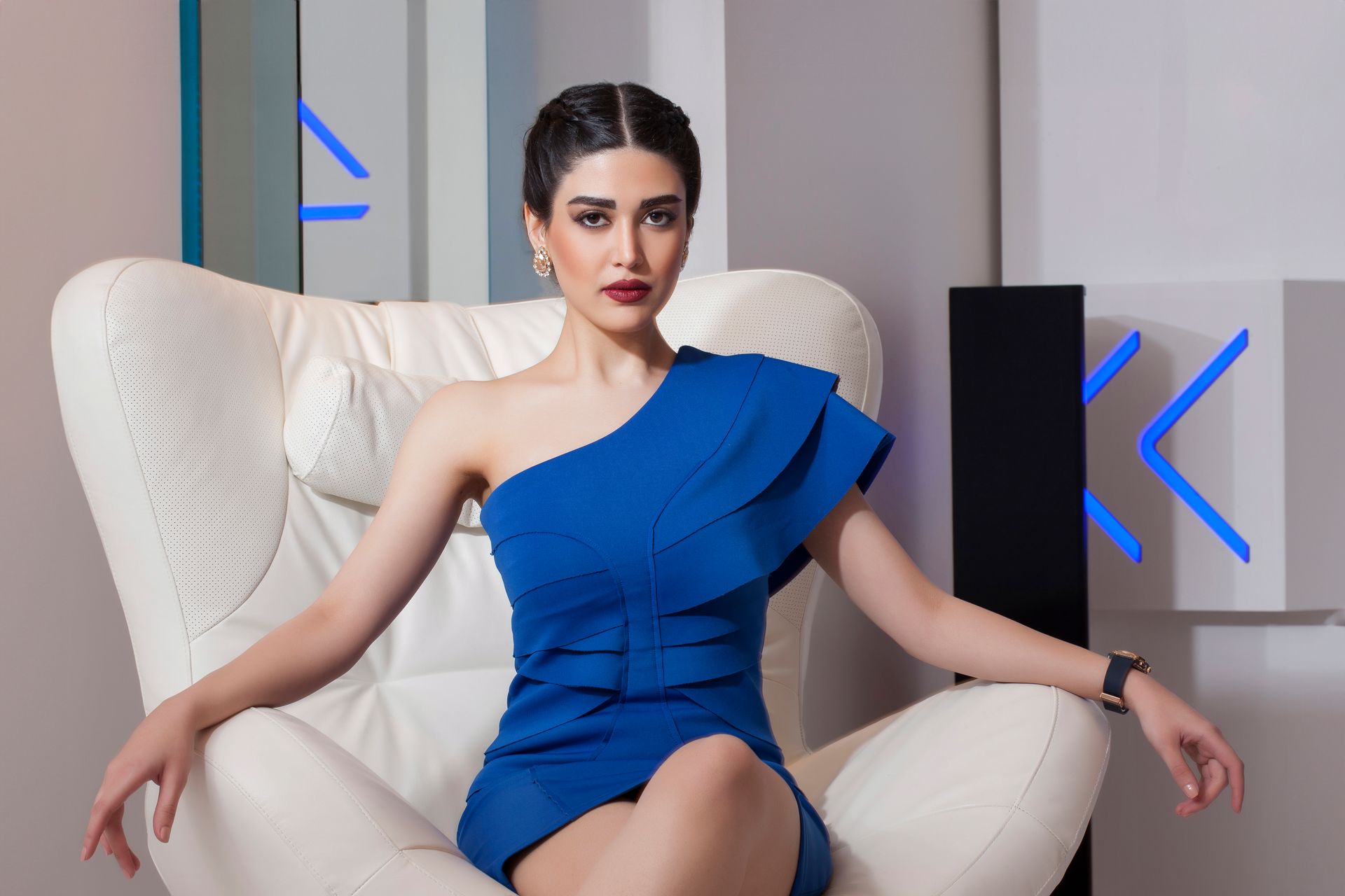 A bride in a wedding dress is standing on a boat feeding seagulls.