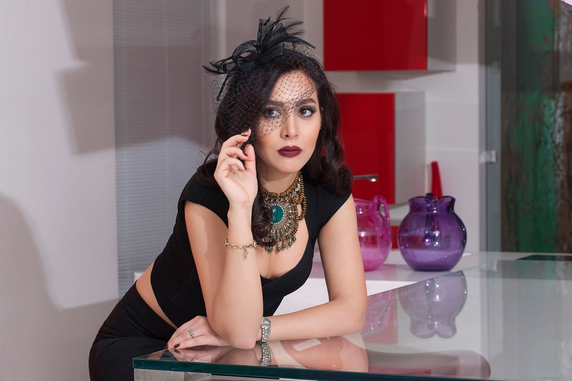 A man and a woman are toasting with wine glasses in a restaurant.