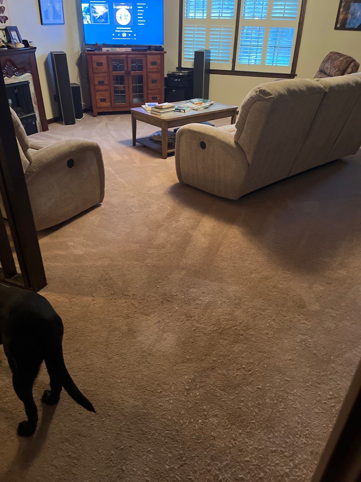 A living room with a couch and two chairs