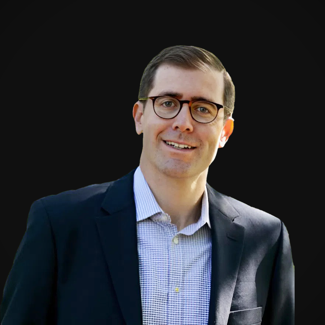 Samuel Elder from Wazee Street Capital Management smiling against a black background.