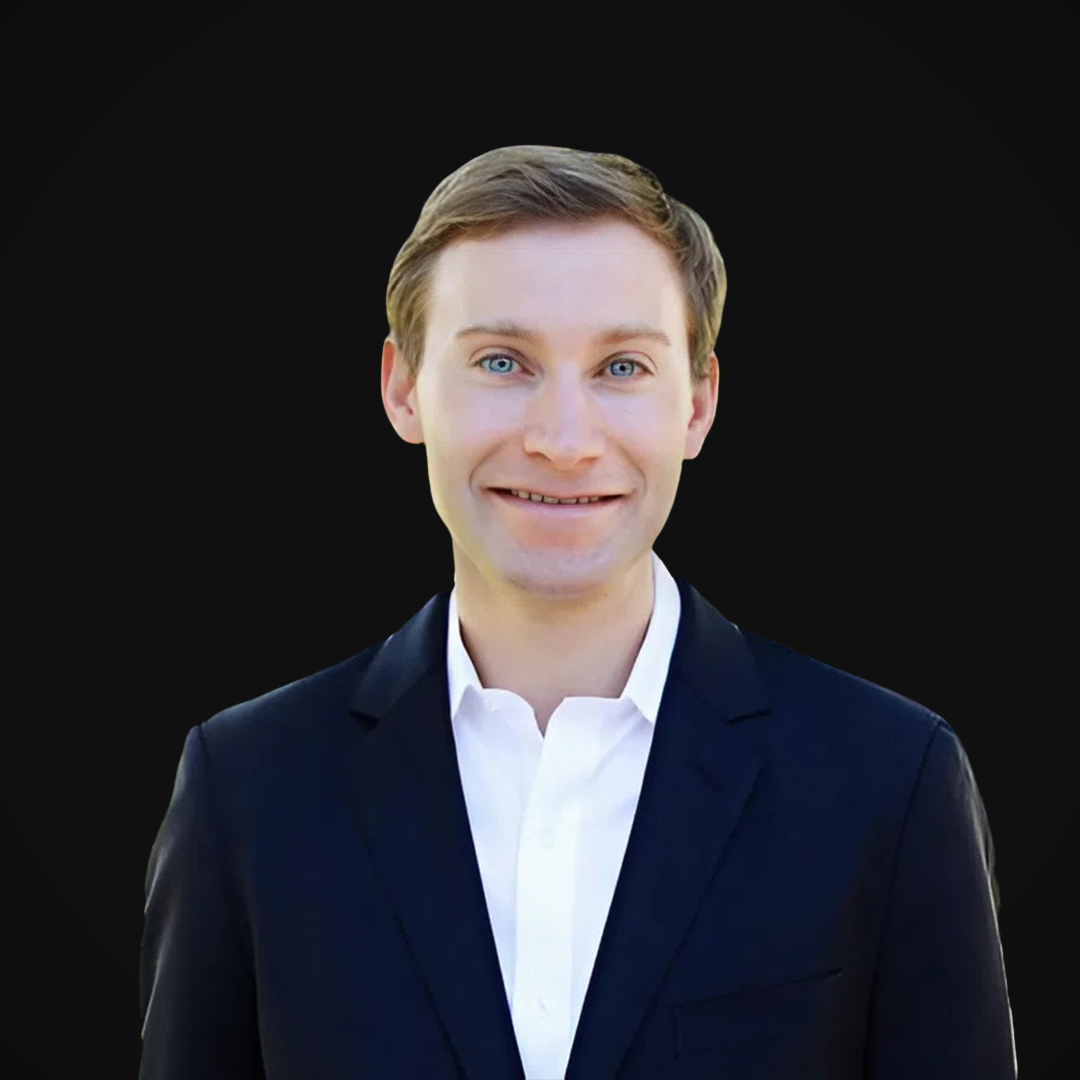 Todd Wood from Wazee Street Capital Management smiling against a black background.