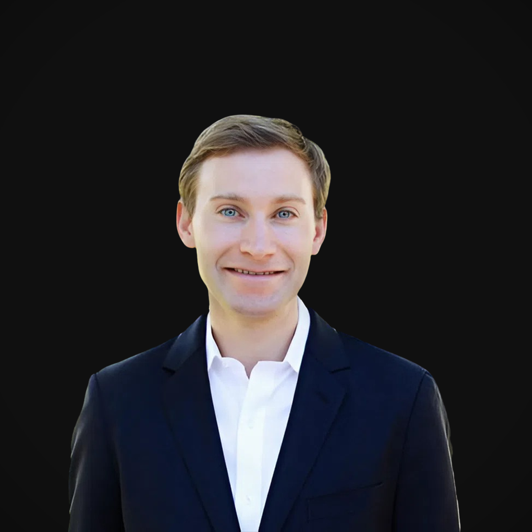 Todd Wood from Wazee Street Capital Management smiling against a black background.