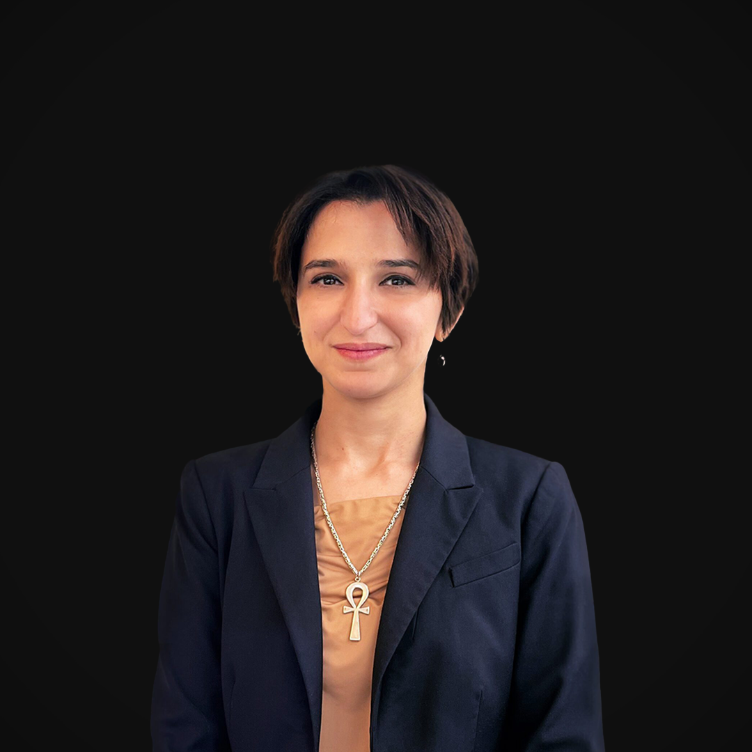 Nermin Arafa from Wazee Street Capital Management smiling in front of a black backdrop.