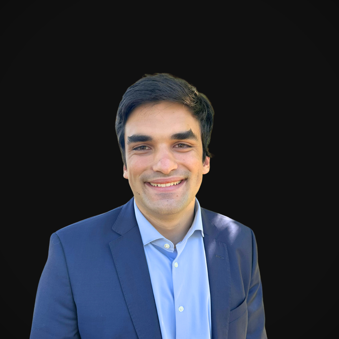 Matthew Collins from Wazee Street Capital Management smiling in front of a black backdrop.